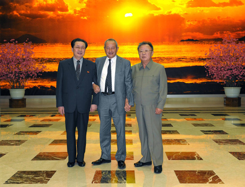 Naguib Sawiris stands between Kim Jong Il and Jang Song Thaek.
