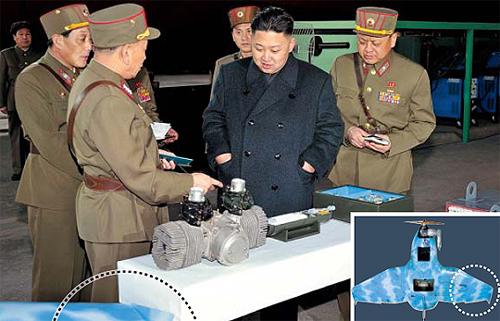 Kim Jong Un is shown looking at a small engine in this image released by the Korean Central News Agency on March 25, 2013.