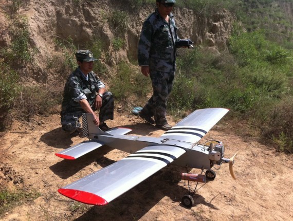 An unmanned aircraft produced by Taiyuan Navigation Friend Aviation Technology is seen with Chinese military members (Company photo)