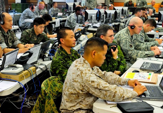 U.S. service members, 1st Canadian Division troops and soldiers from the Third Republic of Korea Army work side-by-side in the I Corps joint operations center in Camp Yongin, South Korea during a combined arms rehearsal meeting Aug. 21. (DOD Photo / Daniel Schroeder)