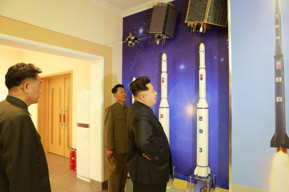 Kim Jong Un observes models of the Unha rocket series and the satellites they were launching into orbit in this image from the Rodong Sinmun on May 3, 2015.