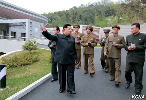 Kim Jong Un strolls through the General Satellite Control and Command Centre in this undated picture carried by KCNA on May 3, 2015.