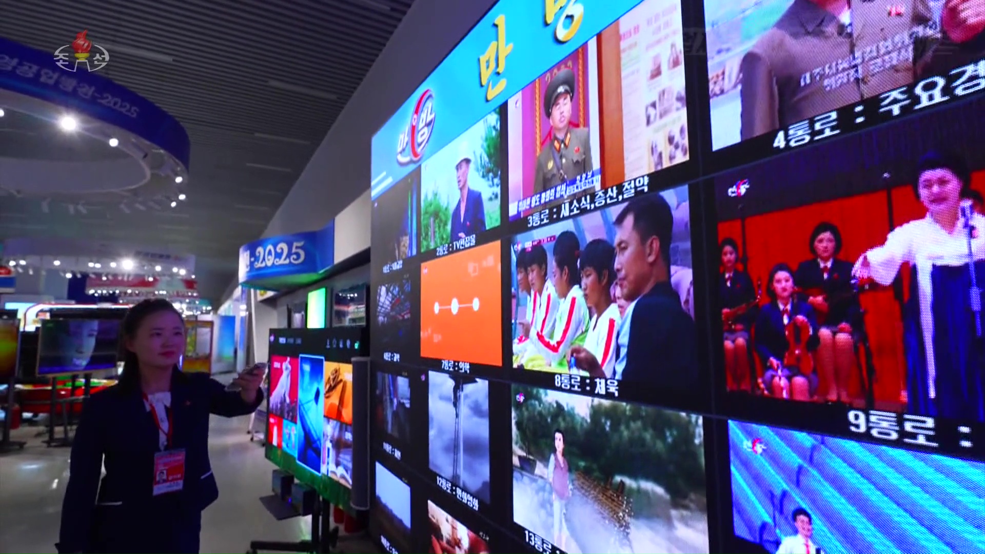 A wall of video monitors, each showing a different TV program